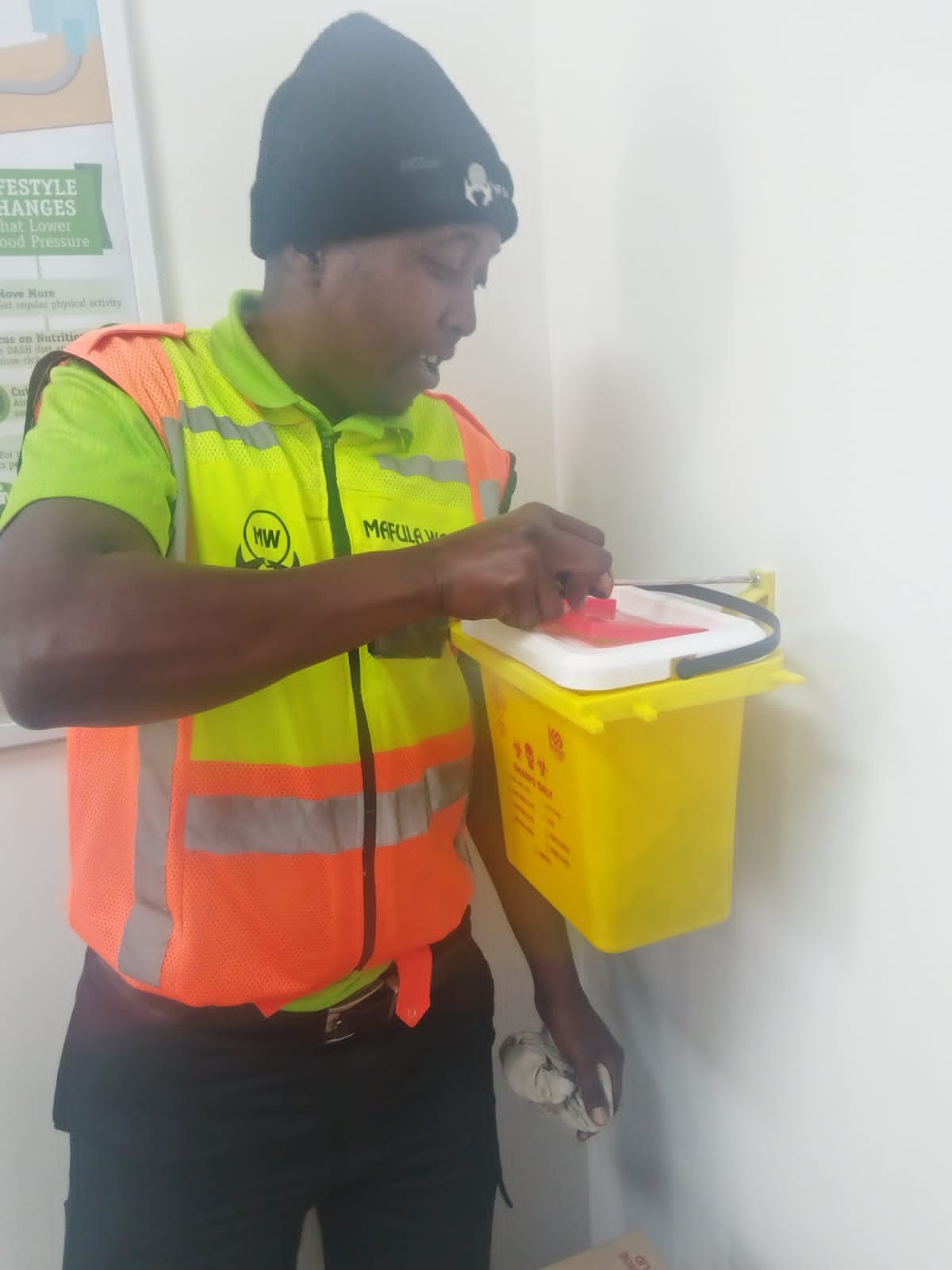 Yellow sharps container in service at a healthcare facility