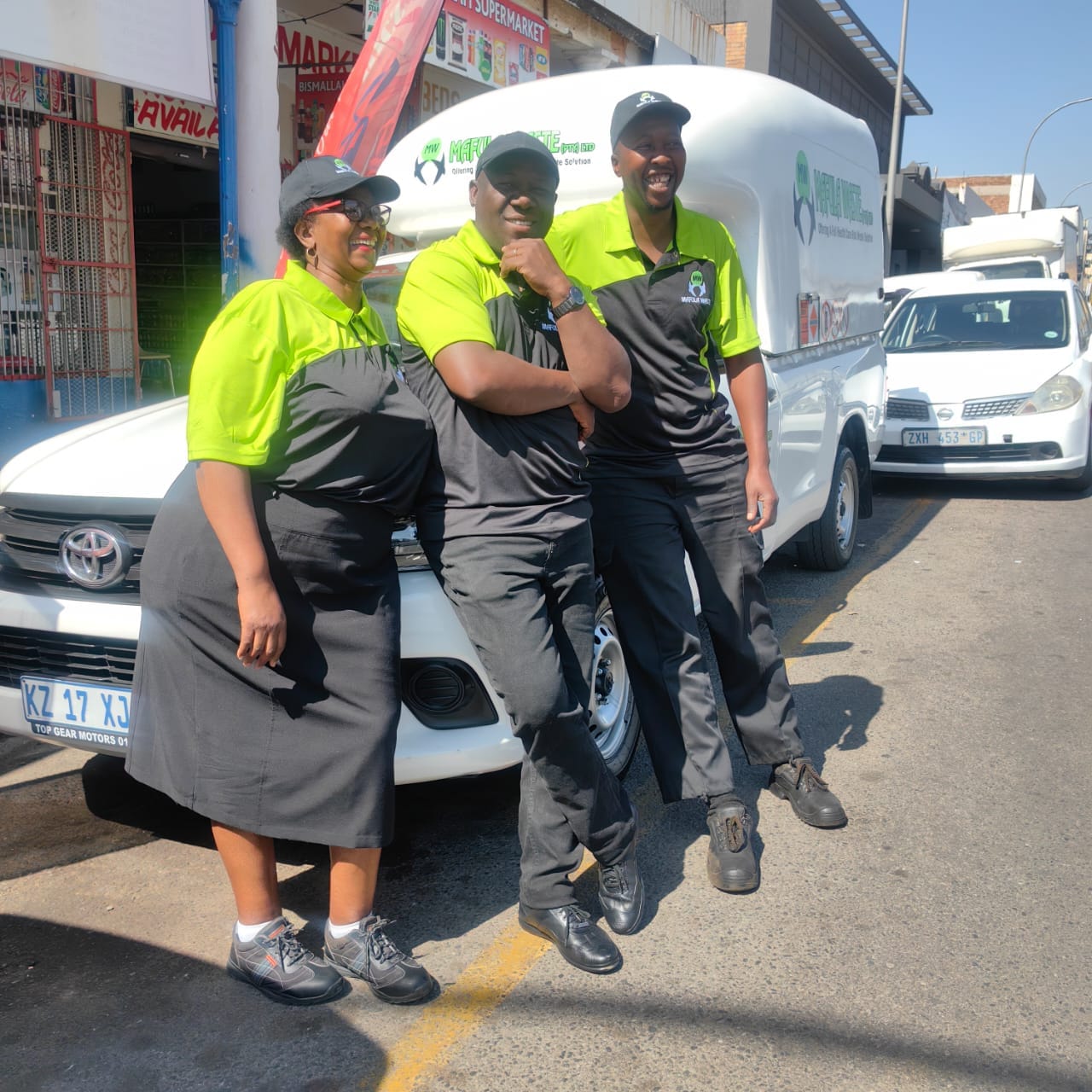 Mafula Waste crew members in branded workwear